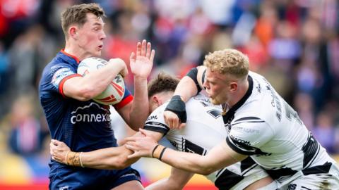  Hull KR player Jack Broadbent is tackled
