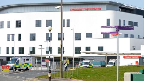 A general view of the Royal Infirmary of Edinburgh hospital, with ambulances visible that are parked in front.