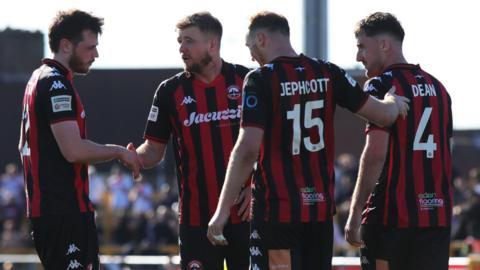 Truro City celebrate a goal at Sutton United