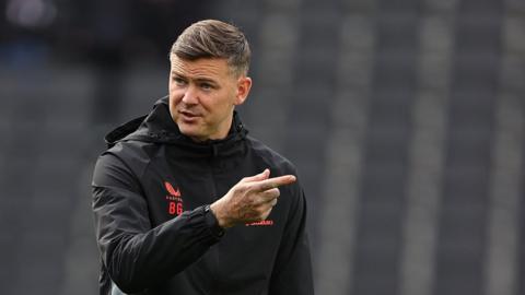 Ben Gladwin working as a coach at MK Dons