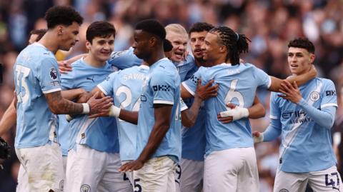 Man City players celebrating.