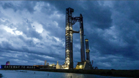 Stormy weather, rolling in from the Gulf at sunrise, surrounds the SpaceX Starship spacecraft and the Super Heavy Booster as preparations continue for the 12th test flight of the Starship spacecraft in Starbase, Texas, U.S., May 21, 2026.