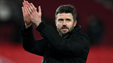 Middlesbrough boss Michael Carrick claps the travelling Boro fans after the 3-1 win at Stoke