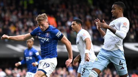 Liam Delap gets ahead of Ezri Konsa to score for Ipswich in Sunday's draw.