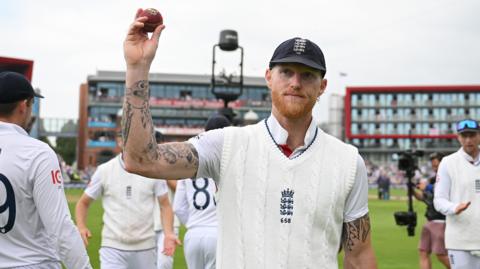 Ben Stokes holds aloft the match ball after taking five wickets