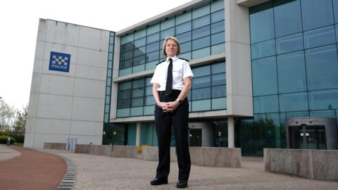 Northumbria Police's Chief Constable Vanessa Jardine wearing her uniform and standing in front of Northumbria Police's headquarters.