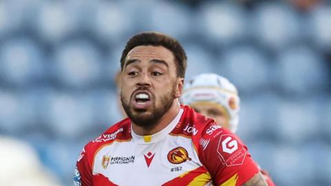 Matt Ikuvalu, with ball in hand, playing for Catalans Dragons