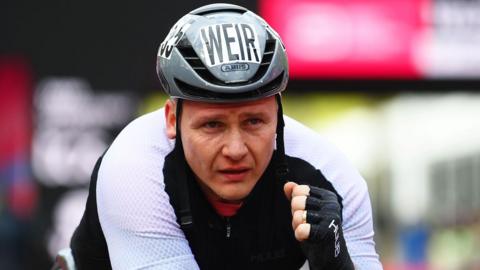 Great Britain's David Weir gives a thumbs up after completing the London Marathon
