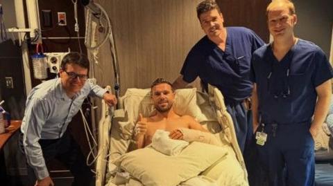 A picture showing Jordan Henderson in hospital after surgery