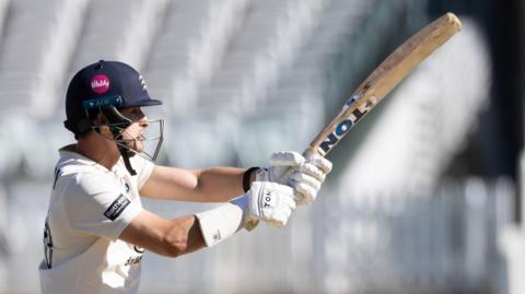 Middlesex captain Leus du Plooy plays a shot