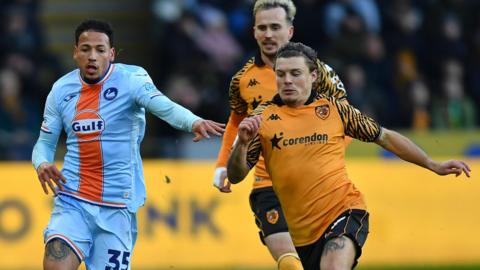 Swansea City forward Ronald and Hull City midfielder Regan Slater 