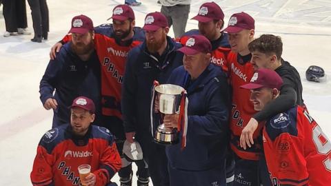 Phantoms pose with winning trophy