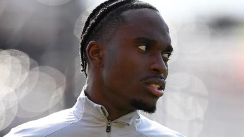 Jay Matete looking to the side 