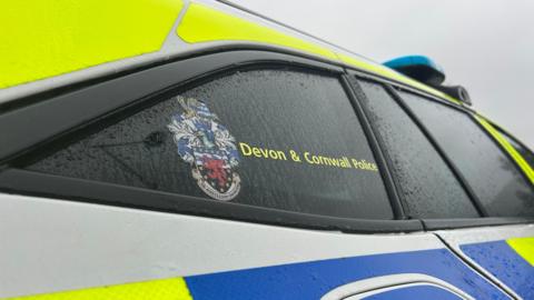 A generic image of the side of a Devon and Cornwall Police vehicle showing the force's branding.