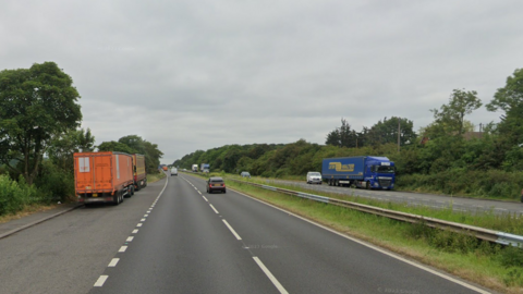 Google Street View image of the A1 in Nottinghamshire showing cars and lorries on either side of the road