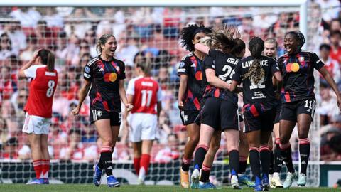 Lyon players celebrate