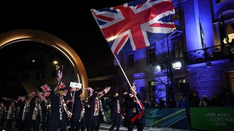 Britain's flag bearer Brad Hall