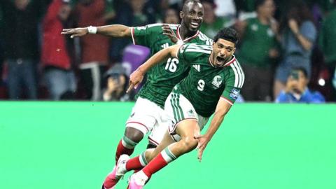 Raul Jimenez wheels away in celebration