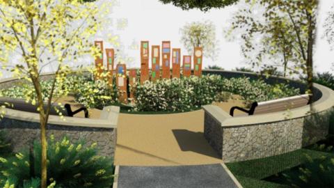 An artist's impression of a proposed memorial garden. The circular area is surrounded by a stone wall with benches. The inside of the area has a light coloured walkway, and in the centre stand several steel monoliths with coloured glass.