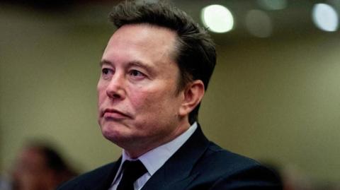 Tesla CEO and X owner Elon Musk listens as US President-elect Donald Trump speaks during a meeting with House Republicans at the Hyatt Regency hotel in Washington, DC, U.S. on November 13, 2024.