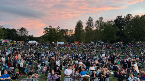 Thousands of people line Telford Town Park for the balloon fiesta Night Glow event as dusk falls