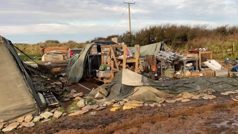 A general view of the Noon Cregg CIC Veterans Retreat showing tents blown over and belongings strewn all over the ground.