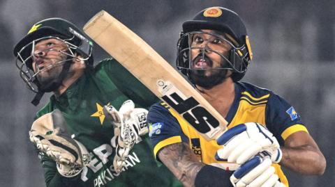 Pakistan wicketkeeper Usman Khan and Sri Lanka batter Kamil Mishara during a Twenty20 international in 2025