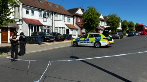 Police outside houses in Golders Green