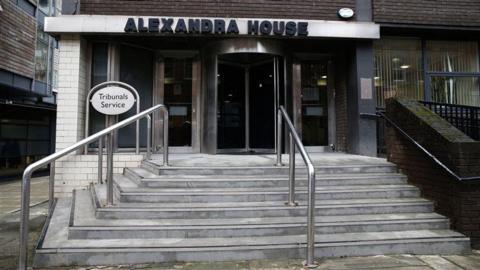 Steps leading up to a court building which reads Alexandra House