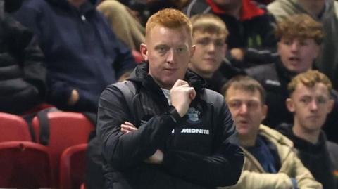Will Still standing on the touchline