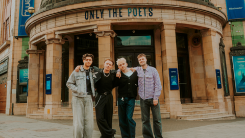 Only the Poets standing outside the O2 Academy Brixton in London, with "Only the Poets" templated in black capital letters on the dome outside it.