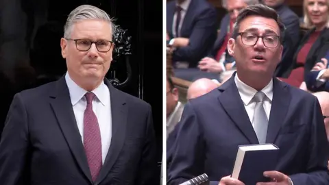 Starmer rests his chin on his left hand