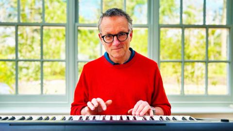 Michael Mosley playing a piano