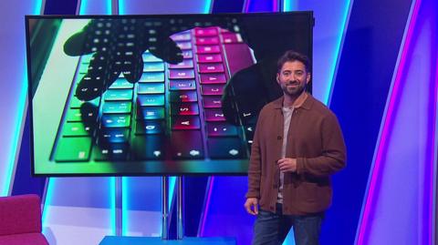 Ricky in the studio with a computer keyboard in the screen