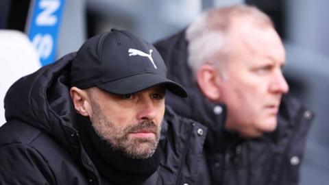 Derby County boss Paul Warne looks on