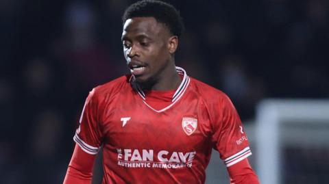 David Tutonda playing for Morecambe against Doncaster Rovers in 2025