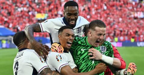 England celebrate beating Switzerland on penalties