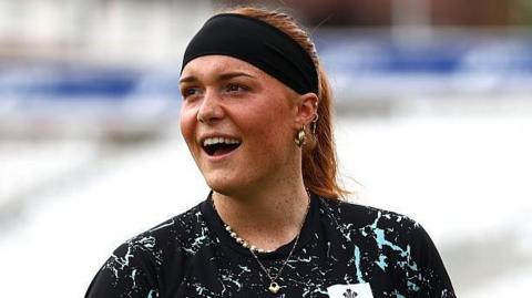 Surrey teenager Jemima Spence warms up before a match