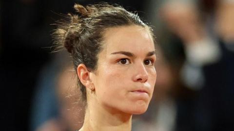 France's Lois Boisson reacts after a point at the French Open