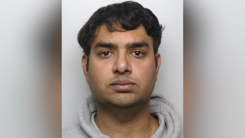 Muhammad Arshad mugshot. He has short brown hair and is wearing a grey hoodie.