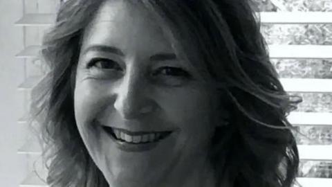 Close up black and white image of Samantha Mickleburgh 