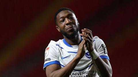 Ebou Adams applauds the Portsmouth fans after the game against Charlton Athletic