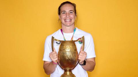 Emily Scarratt holds the Rugby World Cup