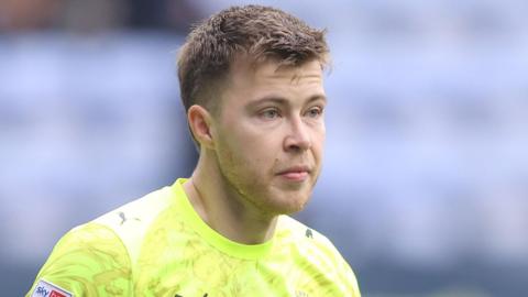 Bailey Peacock-Farrell in action for Blackpool this season