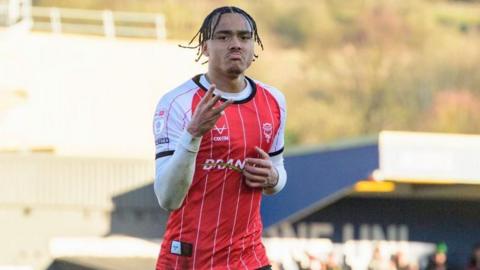 Jovon Makama celebrates his hat-trick against Bristol Rovers