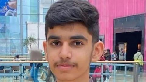 A picture of a 15-year-old boy in a shopping centre