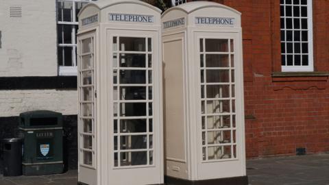 Cream phone boxes