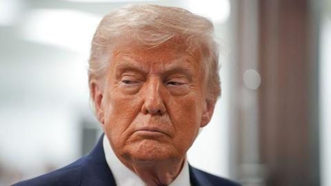 A close-up picture of US President Donald Trump's face.