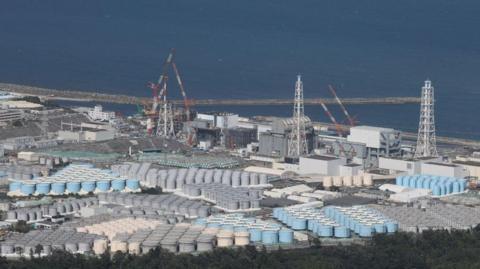 This aerial picture shows storage tanks used for storing treated water at TEPCO's crippled Fukushima Daiichi Nuclear Power Plant 