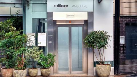 Angelica and Crafthouse lift entrance, Trinity Leeds shopping centre